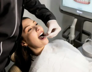 a young lady getting a dental treatment in a Orthodontics Near You